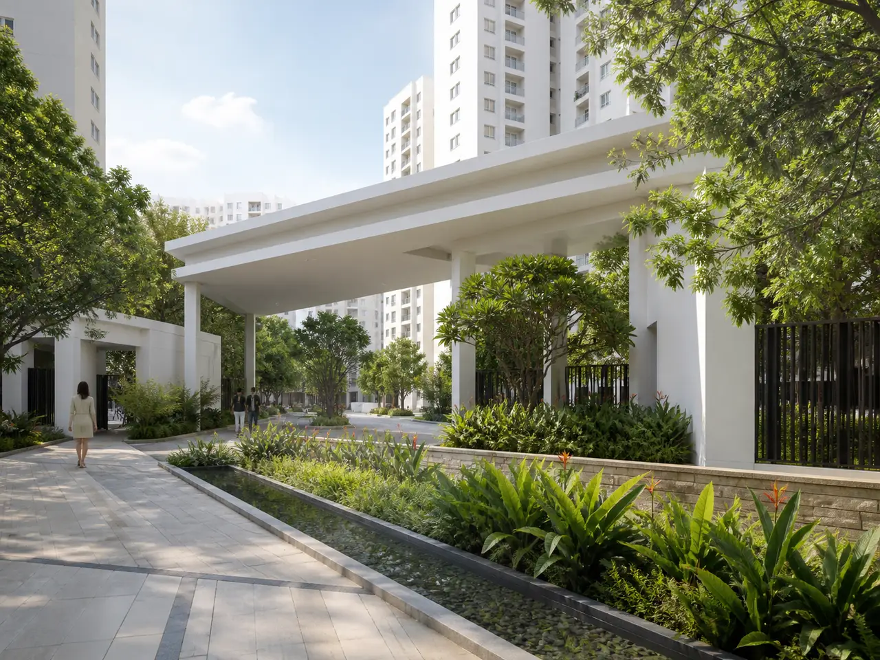 Urbanrise The Living Wave white residential arrival canopy beside tropical planting and a shallow rain-garden edge